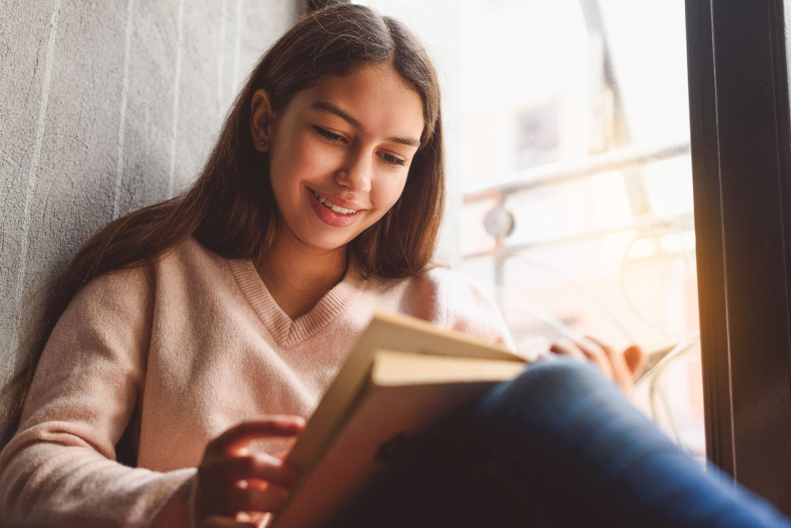 Teenage girl reading a book